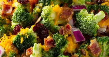Amish Broccoli Cheddar Salad with fresh broccoli, cheese, and dressing in a bowl