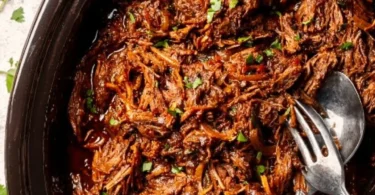 Delicious Beef Barbacoa served in a tortilla with fresh toppings