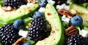 A vibrant Blackberry Avocado Salad with fresh ingredients and colorful presentation.