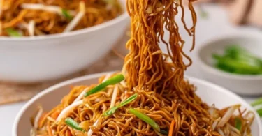 Delicious bowl of Classic Chinese Chow Mein served with vegetables and chicken.