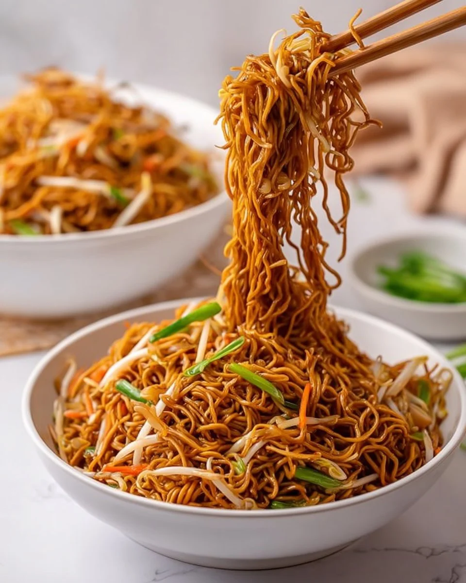 Delicious bowl of Classic Chinese Chow Mein served with vegetables and chicken.