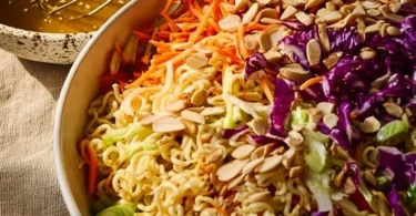 Crunchy ramen noodle salad with colorful vegetables and dressing