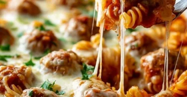 Delicious Dump and Bake Meatball Casserole topped with melted cheese