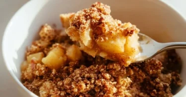 Healthy Breakfast Apple Crumble topped with oats and fresh apples