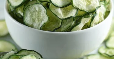 Homemade salt and vinegar cucumber chips on a plate