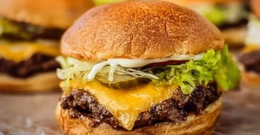 Homemade smash burger with melted cheese and fresh toppings on a bun