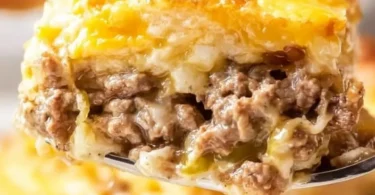 Delicious White Castle Casserole topped with melted cheese and savory beef